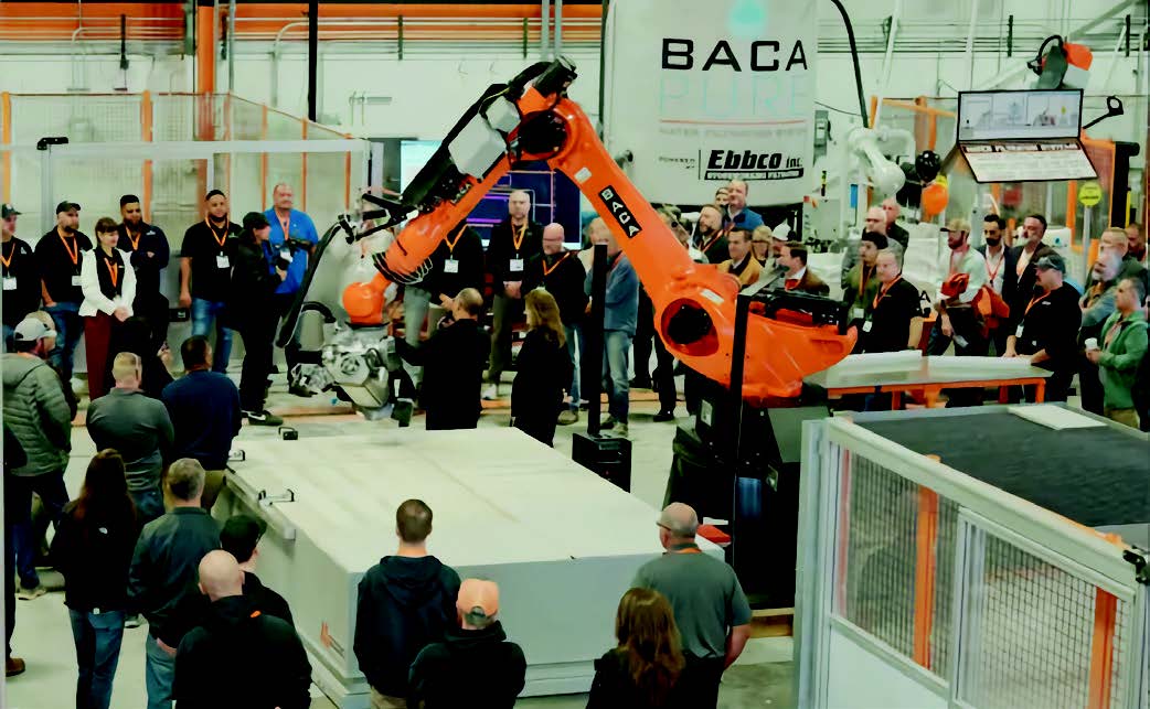 Crowd of people arround an RSJM machine watching a demo.